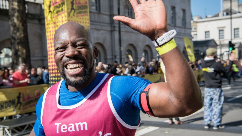A very happy Tommy's runner crossing the LLHM finish line