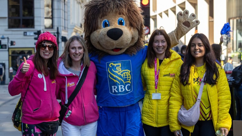 LLHM staff members with RBC mascot Leo the Lion